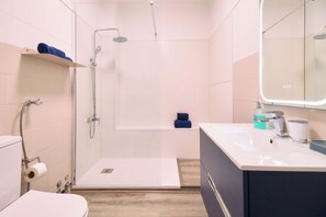 Bathtub, hair dryer, towels, soap