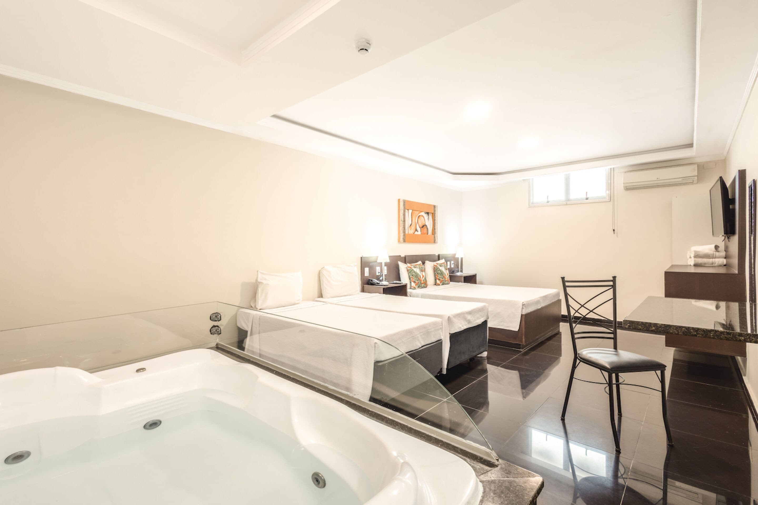superior quadruple room, jetted tub | private spa tub
