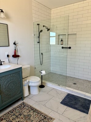 Bathtub, hair dryer, towels, soap