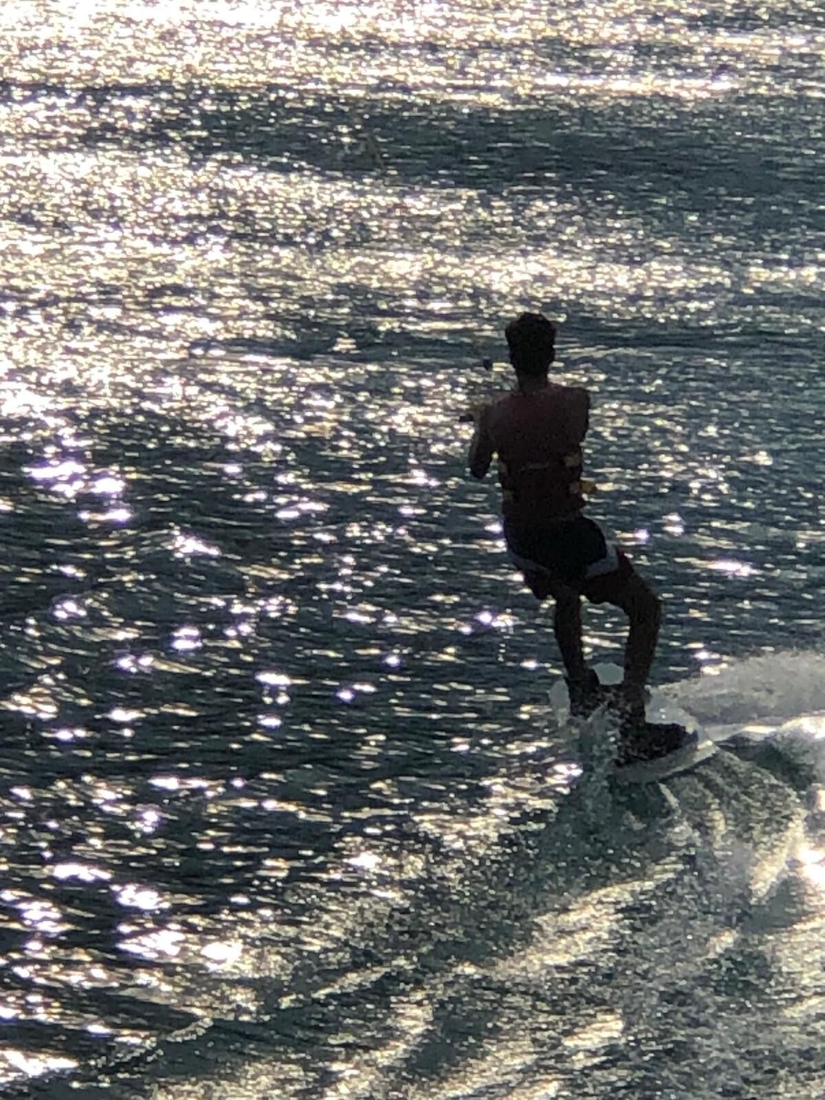 A person surfing on a wave.