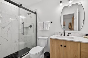 Combined shower/tub, hair dryer, towels, toilet paper