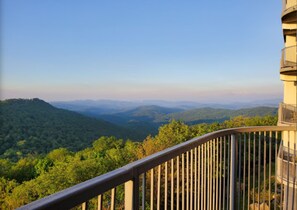 Enjoy breathtaking views of the surrounding mountains from this balcony.