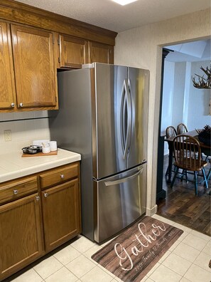 Enjoy meals in the kitchen with stainless steel appliances and dining area.