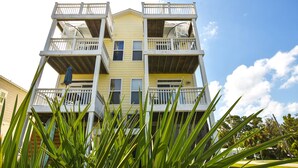 A multi-story building with balconies and a clear sky. - Enjoy Belle of the Beach -  Your Family Get Away!  **Linens Included** (Carolina Beach)