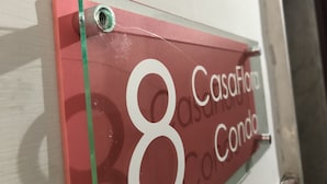 A sign with the number 8 and the text "CasaFloro Condo" on a red background. - CasaCondo @Flora: Relax in a Spacious Condo with Jacuzzi - Your Naples Getaway (Torre del Greco)