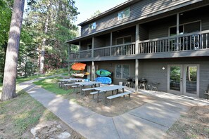 Outdoor dining - All 4 lakefront condos! Private beach, dock, sauna, club room, decks. (Webb Lake)