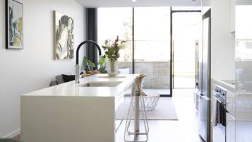 One Bedroom Apartment With Parking | Private kitchen | Full-sized fridge, microwave, oven, stovetop