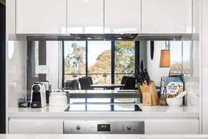 Two Bedroom Apartment With Parking | Private kitchen | Full-size fridge, microwave, oven, stovetop
