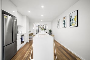 One Bedroom Apartment With Parking | Private kitchen | Full-size fridge, microwave, oven, stovetop