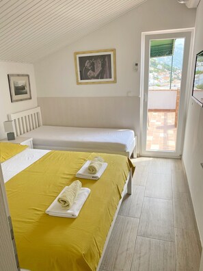 2 quartos, acesso à internet, roupa de cama