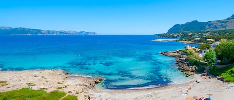 On the beach, sun-loungers, beach towels