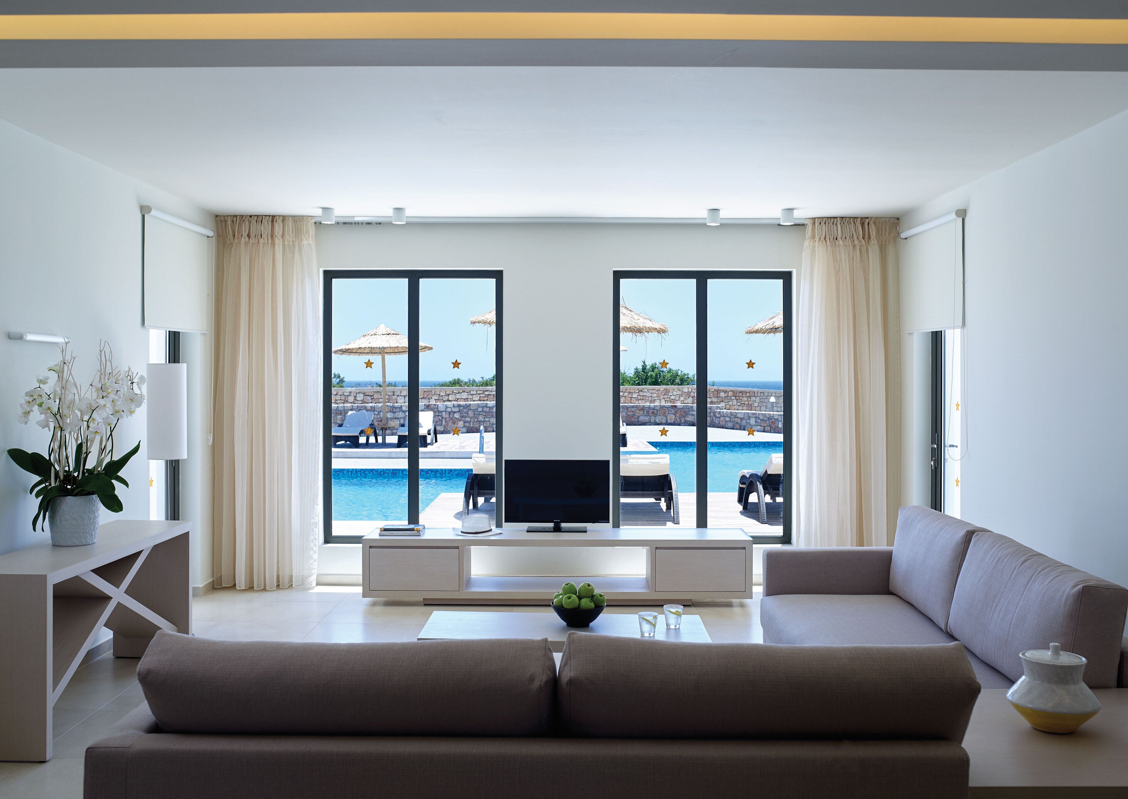 Two Bedroom Suite Swim Up Garden View | Living area | LCD TV, table tennis, books