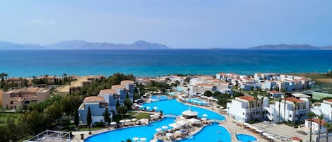 Indoor pool, seasonal outdoor pool, pool umbrellas, pool loungers