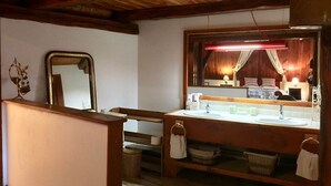 A wooden cabin-style bathroom with a wooden ceiling, a large mirror, two sinks, and a vanity. - SUMMIT CONTINUATION (Méolans-Revel)