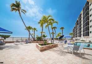 Outdoor dining - Gulf Front 2B/2B Dream Vacation Condo At Carlos Pointe Beach Club With Amazing Views! Gorgeous Beach! Southern Tip of Island! (Fort Myers Beach)