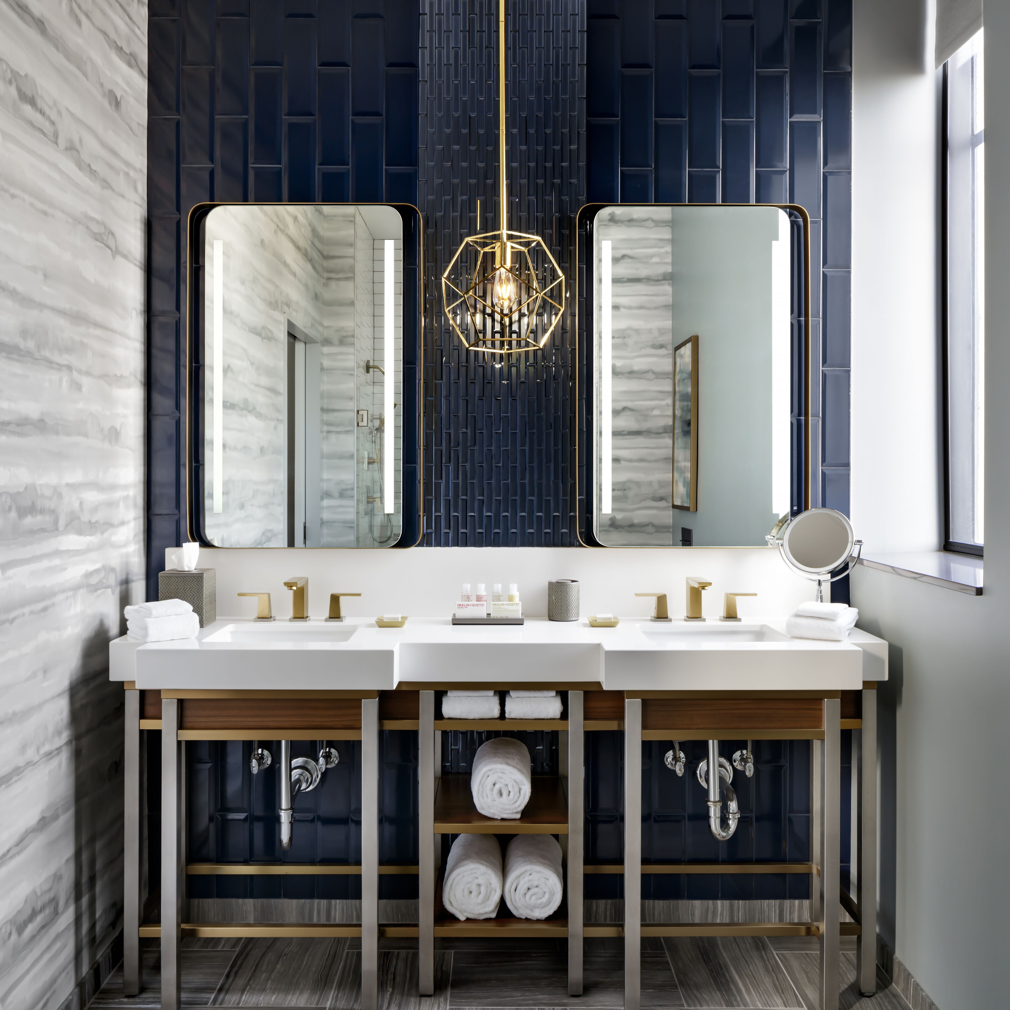 premier suite, 1 king bed with sofa bed, city view | bathroom | designer toiletries, hair dryer, bathrobes, towels