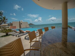 A heated pool, sun loungers