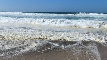 On the beach, sun-loungers, beach towels