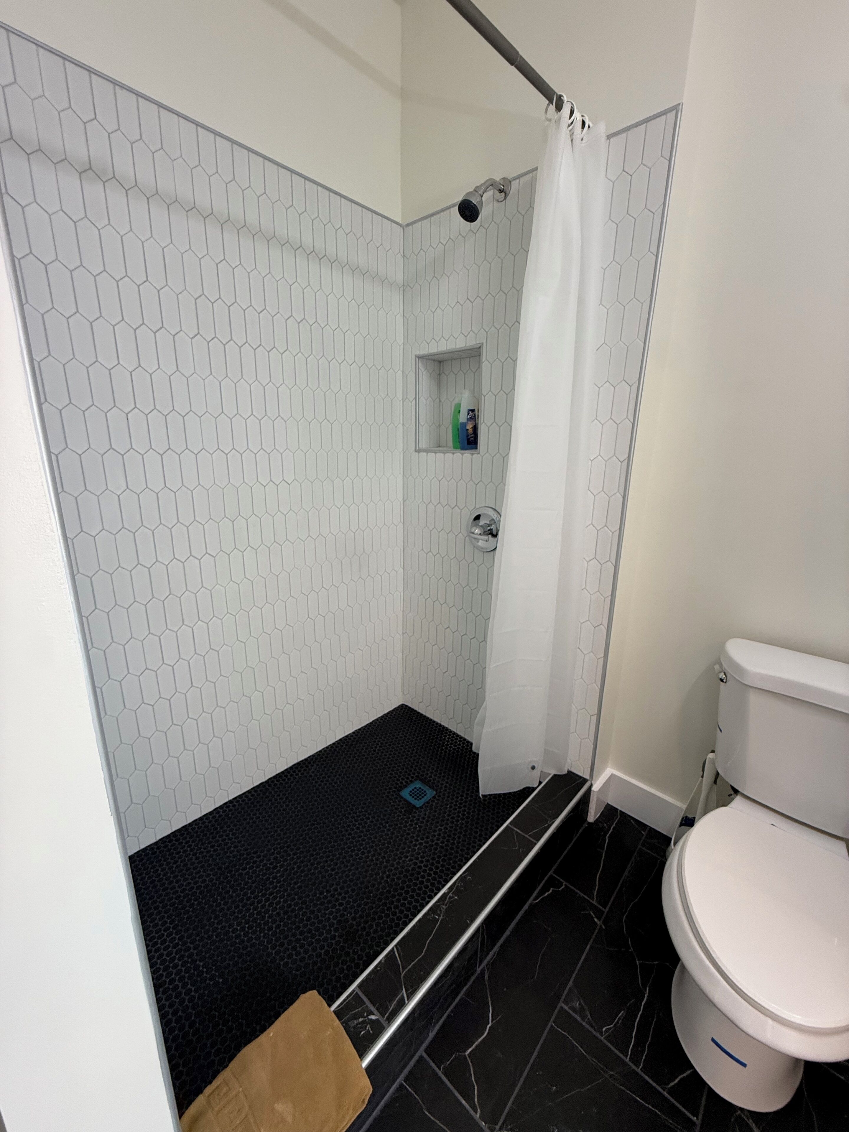 Hair dryer, towels, soap, shampoo