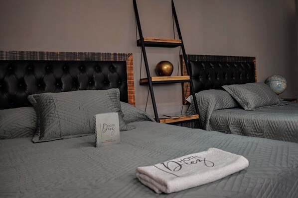 Standard Room, 2 Double Beds | In-room safe, desk, laptop workspace, soundproofing - Capital O Hotel Diez (Celaya)