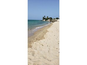 On the beach, sun-loungers, beach towels