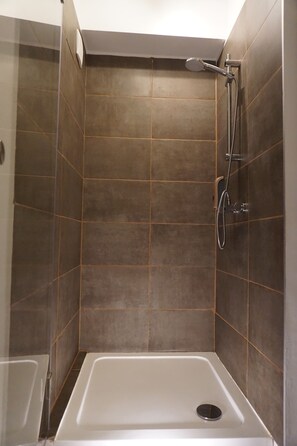 Shower, hair dryer, towels, soap