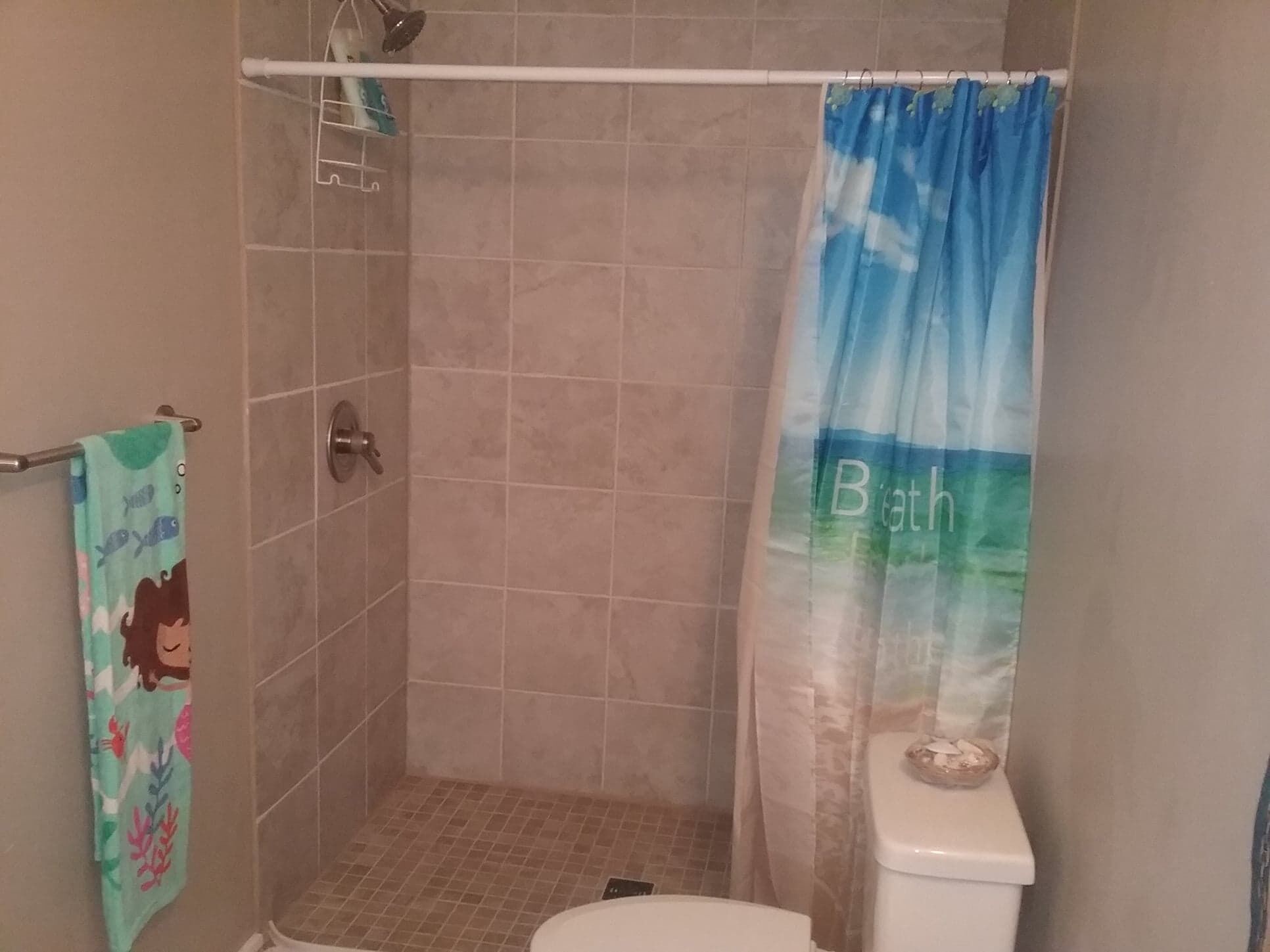 Shower, hair dryer, slippers, towels