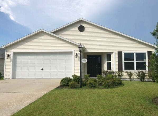 Enjoy a home away from home in this cozy single-story residence with a front porch and garage.