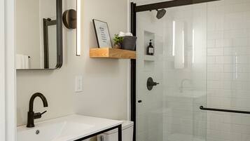 Shower, hair dryer, towels, soap