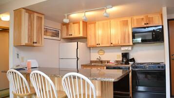 Microwave, stovetop, dishwasher, coffee/tea maker