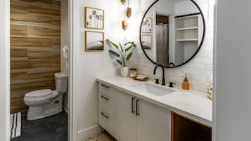Combined shower/tub, hair dryer, towels, soap