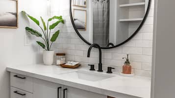 Combined shower/bathtub, hair dryer, towels, soap