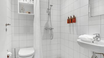 Shower, rainfall showerhead, hair dryer, towels