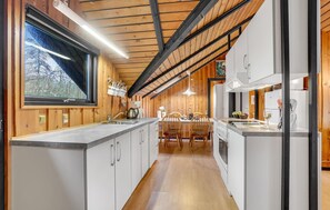 Fridge, stovetop, dishwasher, coffee/tea maker