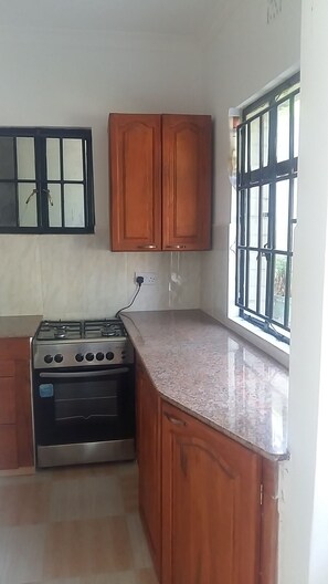 Honeymoon Tree House | Private kitchen | Fridge, stovetop, cookware/dishes/utensils - In-Africa Stay (Arusha)