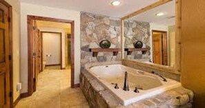 Bathtub, jetted tub, hair dryer, towels