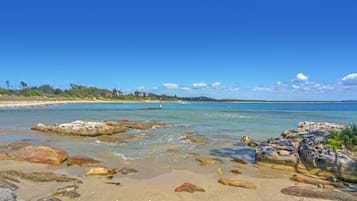 On the beach, sun-loungers