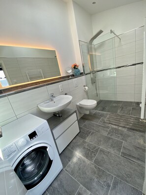 Shower, hair dryer, towels, soap
