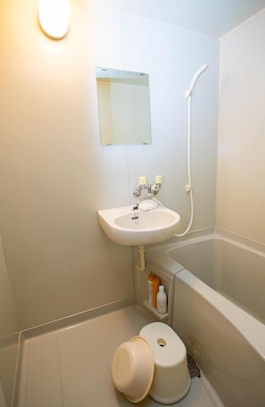 Separate tub and shower, free toiletries, hair dryer, slippers