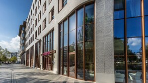 A modern building with large windows and a brick facade. - Prize by Radisson, Antwerp City (Antwerp)