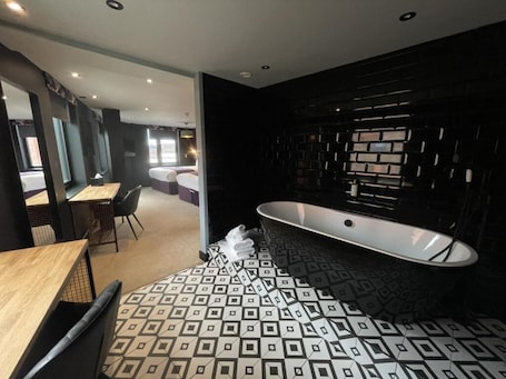 Premium bedding, desk, laptop workspace, blackout drapes