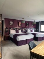 Premium bedding, desk, laptop workspace, blackout drapes