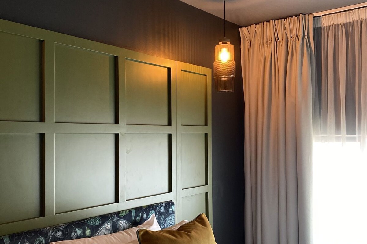 Premium bedding, desk, laptop workspace, blackout drapes