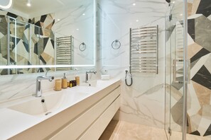 Shower, hair dryer, towels, soap