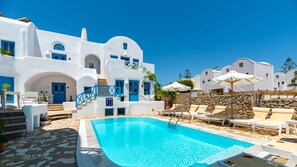 Seasonal outdoor pool, pool umbrellas, pool loungers