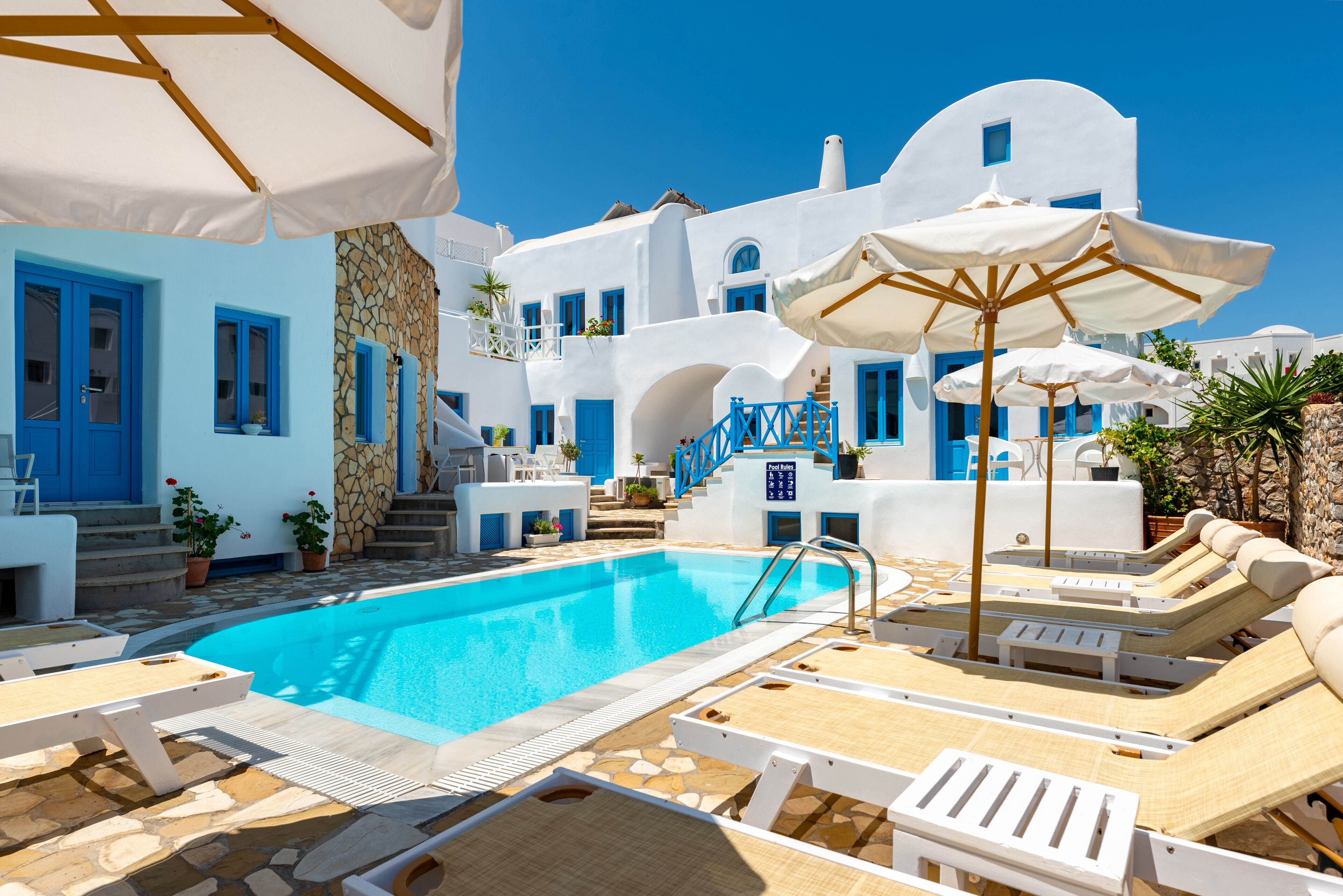 Seasonal outdoor pool, pool umbrellas, pool loungers
