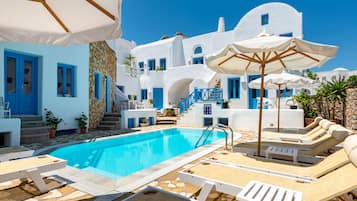 Seasonal outdoor pool, pool umbrellas, pool loungers