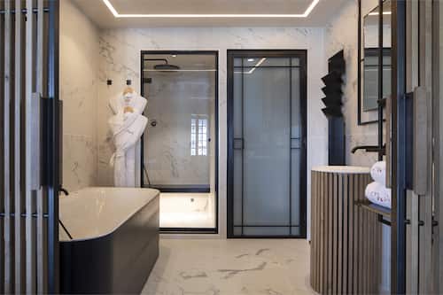 Deluxe Double Room | Bathroom | Designer toiletries, hair dryer, bathrobes, slippers