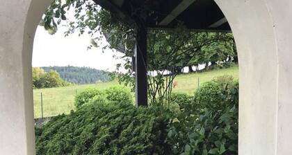 "The Enchanted Cottage" is a chic private garden apartment with gorgeous views.