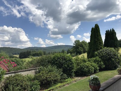 "The Enchanted Cottage" is a chic private garden apartment with gorgeous views.